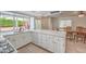 Spacious kitchen with white countertops, stainless steel appliances, and a breakfast bar at 8308 Tide Pool Dr, Las Vegas, NV 89128