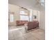 Open-concept living area with vaulted ceilings, fireplace, and tile flooring at 8308 Tide Pool Dr, Las Vegas, NV 89128