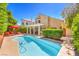 Inviting backyard with a refreshing pool and covered patio area at 8308 Tide Pool Dr, Las Vegas, NV 89128