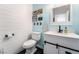 Stylish half-bathroom featuring shiplap accents, modern fixtures, and fresh decor at 8345 Spruce Meadows Ave, Las Vegas, NV 89131