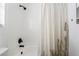 Bright bathroom features a tile shower with a stylish cactus-themed curtain at 8345 Spruce Meadows Ave, Las Vegas, NV 89131