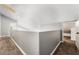 Second floor hallway boasts natural lighting and neutral color palette at 8345 Spruce Meadows Ave, Las Vegas, NV 89131