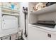 Well-organized laundry room with modern washer and dryer, maximizing space and efficiency at 8345 Spruce Meadows Ave, Las Vegas, NV 89131