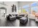 Open-concept living room with abundant seating and natural light, perfect for relaxation at 8345 Spruce Meadows Ave, Las Vegas, NV 89131