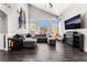 Spacious living room with high ceilings, a modern fireplace, and plenty of natural light at 8345 Spruce Meadows Ave, Las Vegas, NV 89131