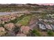 Picturesque aerial view of a residential area, a lake, and a golf course at 85 Luce Del Sole # 2, Henderson, NV 89011