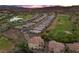 Beautiful aerial view of a home adjacent to the golf course in a Primary-planned community with mountain views at 85 Luce Del Sole # 2, Henderson, NV 89011