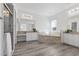 Bright Primary bath with tub, double sinks, walk-in shower, and large mirrors at 85 Luce Del Sole # 2, Henderson, NV 89011