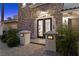 Inviting front entrance with stone facade, double doors, and elegant lighting for a luxurious appeal at 85 Luce Del Sole # 2, Henderson, NV 89011