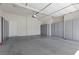 A spacious garage with storage cabinets, offering ample space for vehicles and organization at 85 Luce Del Sole # 2, Henderson, NV 89011