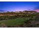 Expansive golf course with mountain views and sprinkler system creates a lush and picturesque setting at 85 Luce Del Sole # 2, Henderson, NV 89011