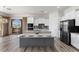 Contemporary kitchen with a large island, stainless steel appliances, and access to a scenic balcony at 85 Luce Del Sole # 2, Henderson, NV 89011
