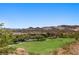 Scenic view overlooking a lush green golf course with mountains in the background at 85 Luce Del Sole # 2, Henderson, NV 89011