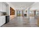 Spacious living room with hardwood floors, built-in shelves, fireplace and access to balcony with views at 85 Luce Del Sole # 2, Henderson, NV 89011