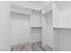 Walk-in closet with an open shelving and hanging rod system for optimal storage at 85 Luce Del Sole # 2, Henderson, NV 89011