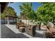 A lush, inviting backyard featuring an outdoor seating area, a spa and a mature shade tree at 8924 Sail Bay Dr, Las Vegas, NV 89117