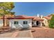 Charming home with a red tiled roof, a stone driveway, and meticulously manicured landscaping at 8924 Sail Bay Dr, Las Vegas, NV 89117