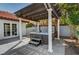 Relaxing outdoor hot tub situated under a pergola with a privacy wall at 8924 Sail Bay Dr, Las Vegas, NV 89117