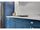 Close up on kitchen cabinets, white countertop, and stainless steel stovetop at 8924 Sail Bay Dr, Las Vegas, NV 89117