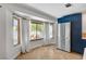 Bright kitchen with bay window, stainless steel appliances, and blue cabinets at 8924 Sail Bay Dr, Las Vegas, NV 89117