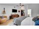 Comfortable main bedroom featuring wood floors, ceiling fan, and stylish decor at 8924 Sail Bay Dr, Las Vegas, NV 89117