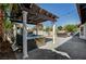 Outdoor patio showcasing a pergola, hot tub, and outdoor seating area at 8924 Sail Bay Dr, Las Vegas, NV 89117