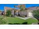 Lovely single-story home with lush green grass, desert landscaping, and an attached two-car garage at 8962 Shale Valley St, Las Vegas, NV 89123