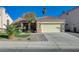Charming single-story home featuring a tile roof, desert landscaping, and an attached two-car garage at 8962 Shale Valley St, Las Vegas, NV 89123