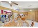Open concept kitchen and dining area with wood table, fireplace, and cabinets at 8962 Shale Valley St, Las Vegas, NV 89123