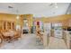 Open concept kitchen with breakfast nook, fireplace, and white appliances at 8962 Shale Valley St, Las Vegas, NV 89123