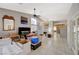 Bright and spacious living room with tile flooring and high ceilings, filled with moving boxes at 8962 Shale Valley St, Las Vegas, NV 89123