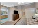 Spacious main bedroom featuring a large bed, ensuite bathroom and walk-in closet at 8962 Shale Valley St, Las Vegas, NV 89123
