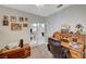 Comfortable home office space with french doors, carpet, and an antique roll top desk at 8962 Shale Valley St, Las Vegas, NV 89123