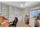 Cozy home office space with built-in shelves, carpet, and a comfortable office chair at 8962 Shale Valley St, Las Vegas, NV 89123