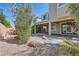 The backyard features desert landscaping with stepping stones at 9020 Tiffany Oaks Ave, Las Vegas, NV 89148
