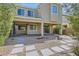 The backyard features desert landscaping with stepping stones and covered patio at 9020 Tiffany Oaks Ave, Las Vegas, NV 89148
