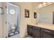 Bright bathroom featuring a vanity and a shower over the toilet at 9020 Tiffany Oaks Ave, Las Vegas, NV 89148
