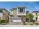 Charming two-story home with stucco siding, a two-car garage, and manicured landscaping at 9020 Tiffany Oaks Ave, Las Vegas, NV 89148