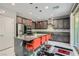 Stylish kitchen featuring a center island, dark cabinetry, and modern stainless steel appliances at 9020 Tiffany Oaks Ave, Las Vegas, NV 89148