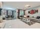 Spacious living room with a modern design, comfortable seating, and an adjacent dining area at 9020 Tiffany Oaks Ave, Las Vegas, NV 89148