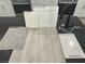 Kitchen design featuring sleek matte black faucet, Liberty Calacatta quartz counters and Elkins White cabinetry at 9077 Rivington Ave, Las Vegas, NV 89148