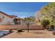 This home's back yard has desert landscaping and a decorative brick perimeter wall at 9912 Woodhouse Dr, Las Vegas, NV 89134