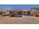 An overview of the back yard area, which includes a patio and desert landscaping at 9912 Woodhouse Dr, Las Vegas, NV 89134