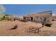 Backyard showing patio and desert landscaping with mature trees at 9912 Woodhouse Dr, Las Vegas, NV 89134