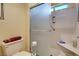 Updated bathroom with glass shower, built-in bench and tile flooring at 9912 Woodhouse Dr, Las Vegas, NV 89134