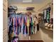 Walk-in closet with metal shelving and hanging rods for organization at 9912 Woodhouse Dr, Las Vegas, NV 89134