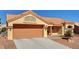Exterior of home showing a terracotta roof, light colored exterior paint and desert landscaping at 9912 Woodhouse Dr, Las Vegas, NV 89134