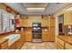 Well-lit kitchen featuring wooden countertops, farmhouse sink, and stainless steel appliances at 9912 Woodhouse Dr, Las Vegas, NV 89134
