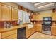 A classic kitchen with wooden cabinets, butcher block countertops, and a white farmhouse sink at 9912 Woodhouse Dr, Las Vegas, NV 89134