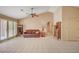 Bright living room featuring neutral paint, tile floors, vaulted ceiling, and sliding door access at 9912 Woodhouse Dr, Las Vegas, NV 89134
